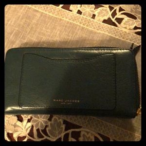 Green wallet… Leather.